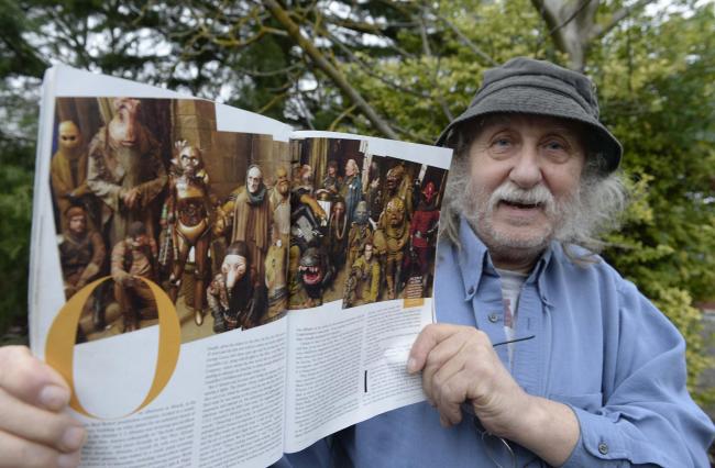 Mick Fryer-Kelsey with his copy of Vanity Fair featuring a photo shoot in his costume.