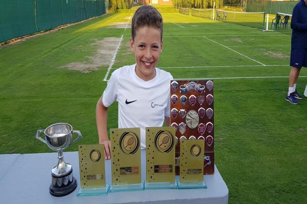 Net gain - Otto Friedlein with his trophies following his success in the Colchester and District Tennis League